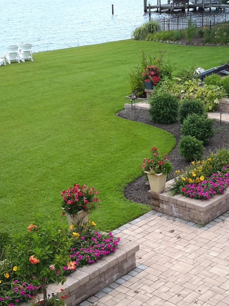 waterfront lawn care and flowers pathways
