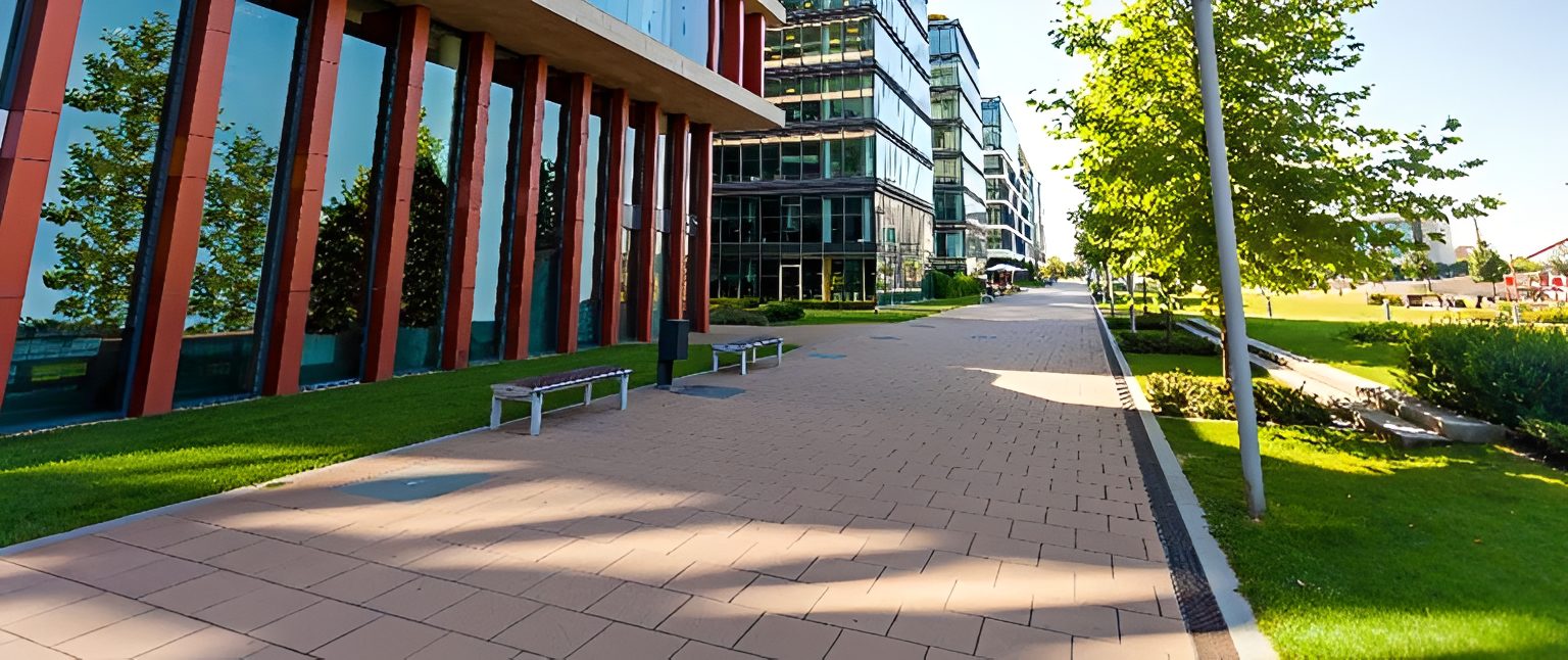 Modern building with trees and walkway.