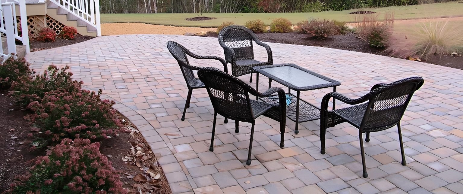 Outdoor patio with table and chairs.