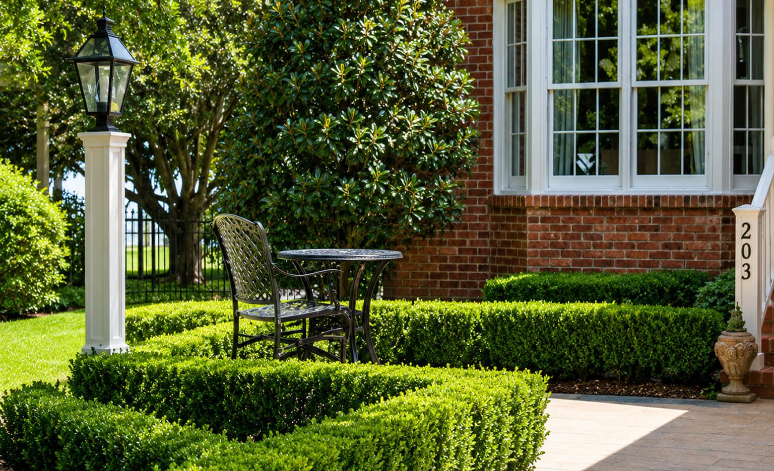 Garden patio with table and chair.