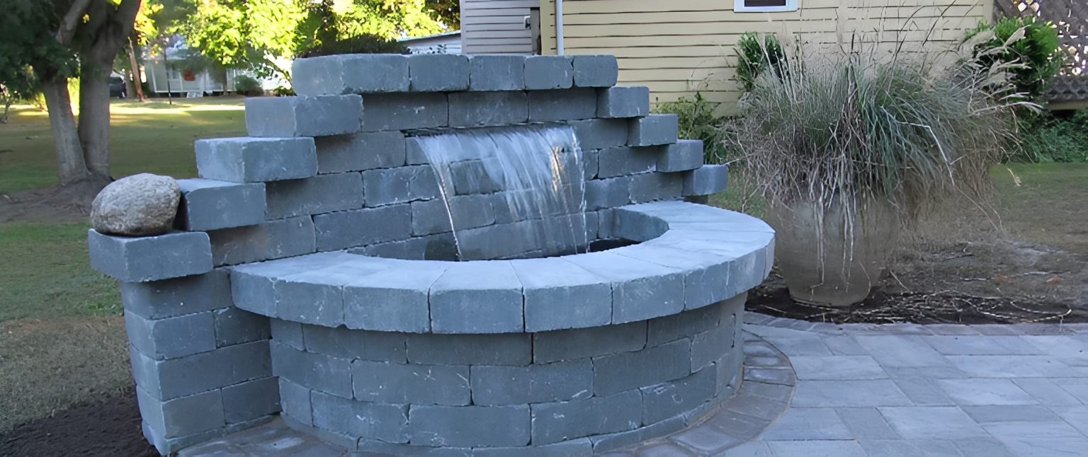 Stone garden fountain with cascading water feature.