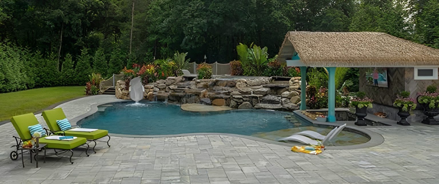 Backyard pool with lounge chairs and hut.