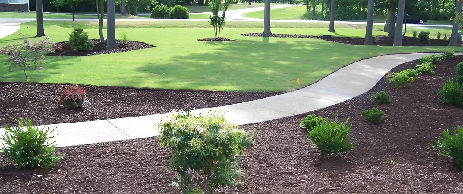 Curved garden path with landscaped greenery.