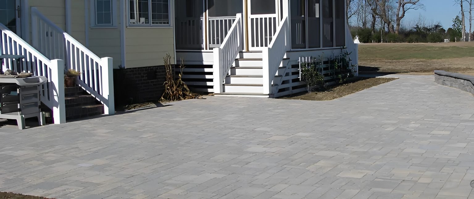 House with stone patio and steps.